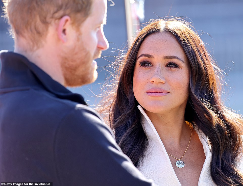 Prince Harry, Duke of Sussex and Meghan, Duchess of Sussex attend the Athletics Competition during day two of the Invictus Games The Hague