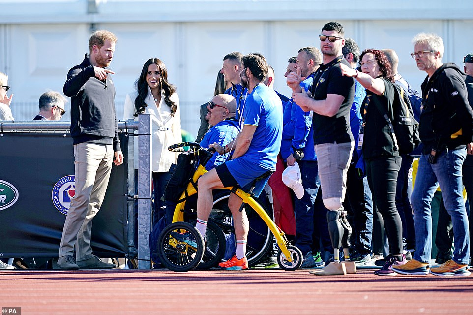 The Duke and Duchess of Sussex greet competitors from Italy as they watched some of the events during their first engagement on Sunday