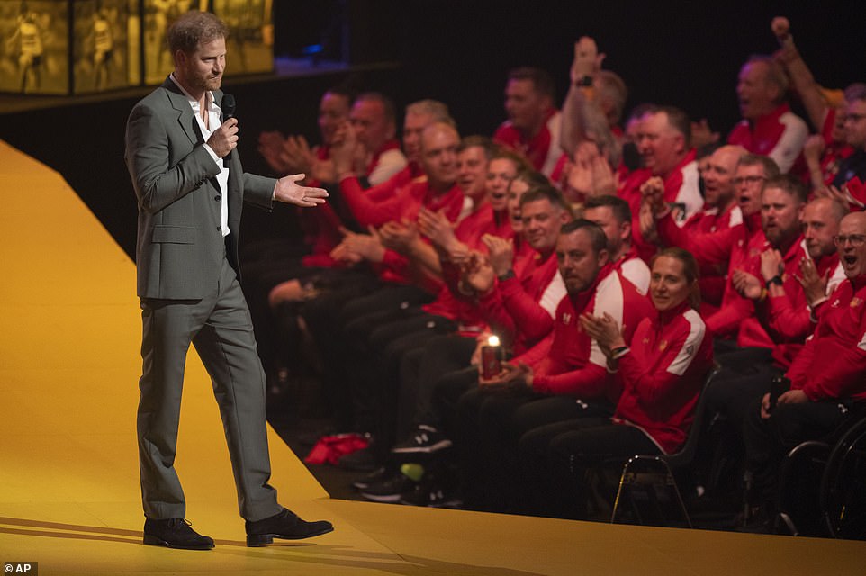 Prince Harry appeared to get emotional after he was introduced to the stage by Meghan