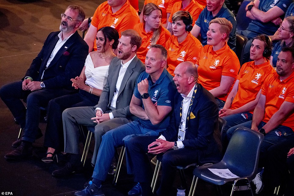 Harry and Meghan in their seats at the opening ceremony of the Invictus Games on Saturday