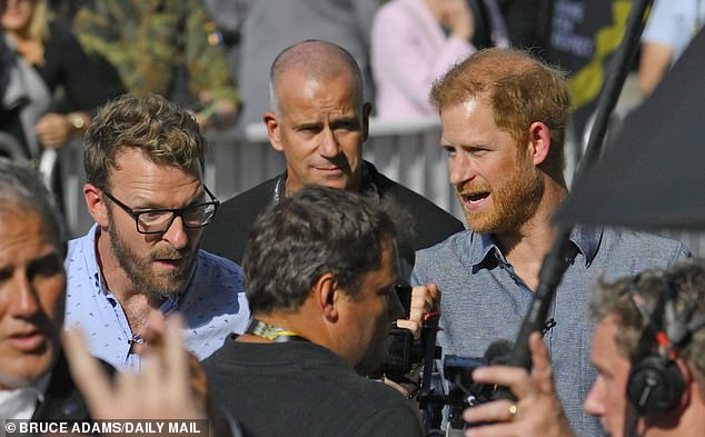 Prince Harry was photographed looking focused while visiting the aircraft in Germany earlier today