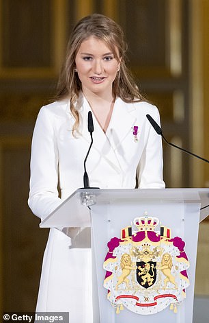 The princess is hugged by mother Mathilde after receiving the Order of Leopold - the country's oldest order of chivalry