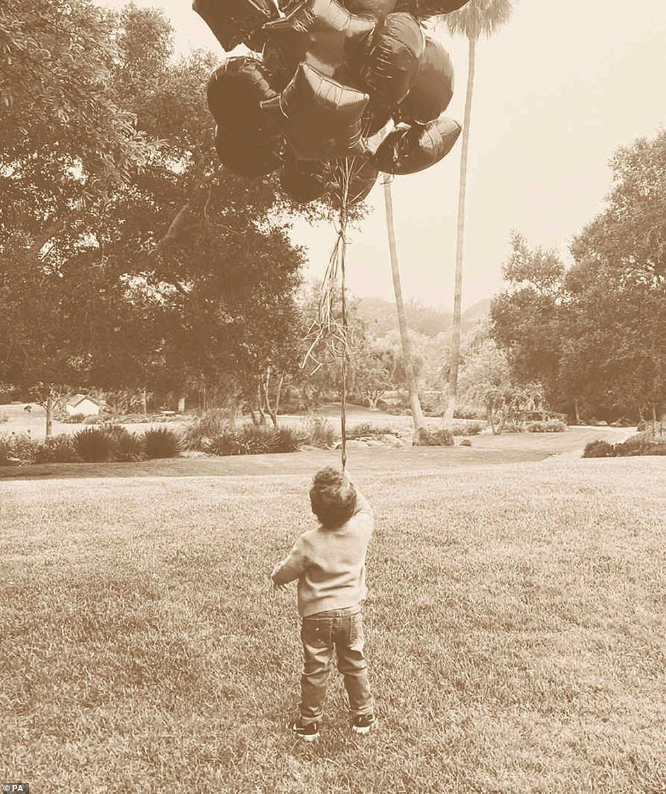 It is the first time Archie has been seen since the Duke and Duchess of Sussex released a photo for his second birthday in May. That image (above) also shielded Archie's face from view