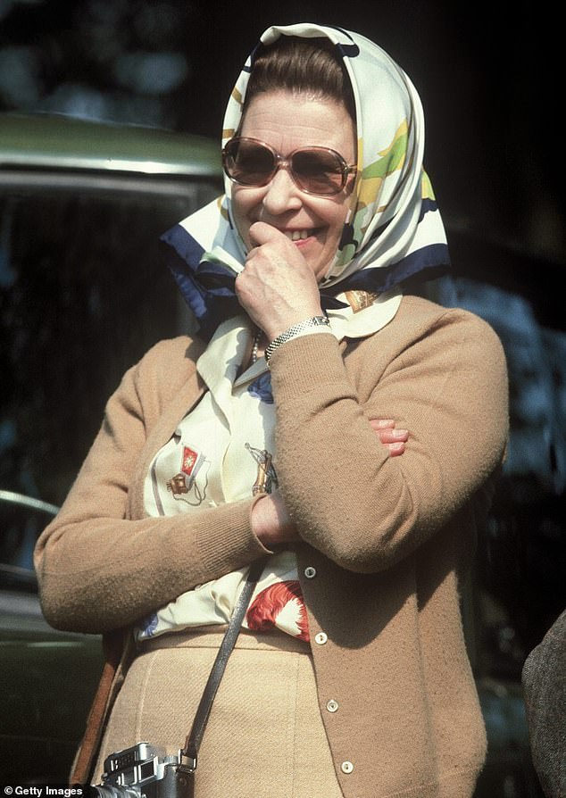 The Duchess of Sussex, 42, was pictured with the £1,000 Hermes Brides de gala scarf. The Queen is pictured wearing the same scarf design in 1982