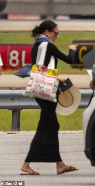 Meghan Markle leaves the tarmac after landing in Atlanta on Monday