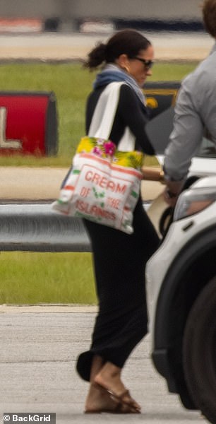 The duchess was seen bringing back a post-vacation glow as well as a souvenir tote emblazoned with the 'Cream of the Islands' from the tiny island of Canouan in St Vincent and the Grenadines