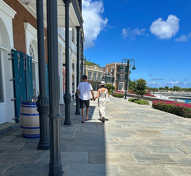 A photo taken by a passer-by on Friday shows the pair leaving a gourmet food store inside the Sandy Lane Yacht Club and Marina in Glossy Bay