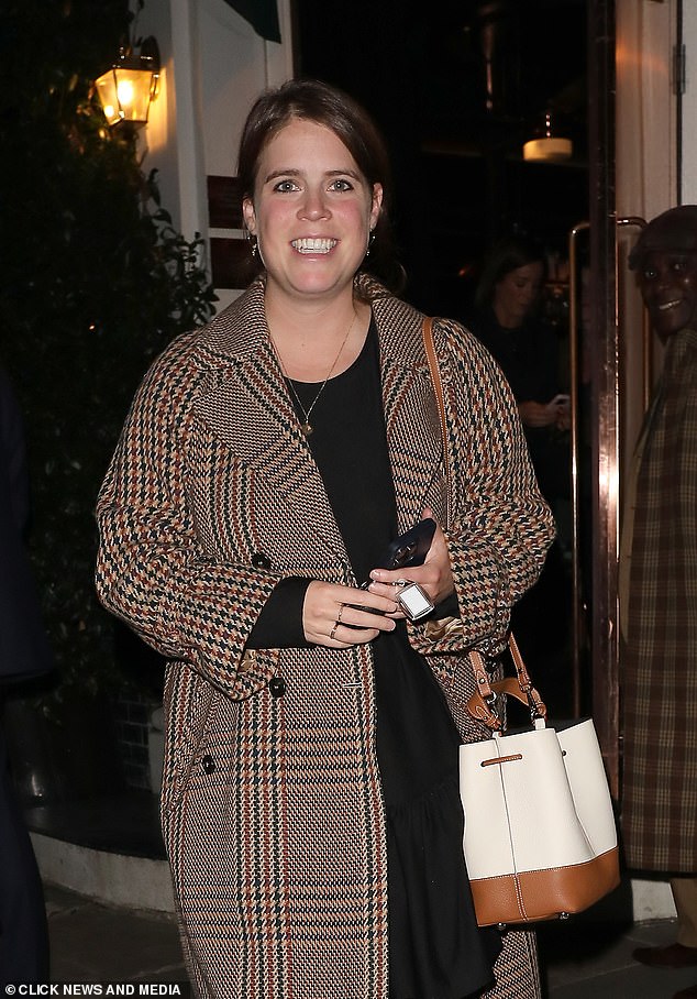 Eugenie wrapped up warm against the Autumnal chill in her trusty MaxMara coat, which she debuted last winter