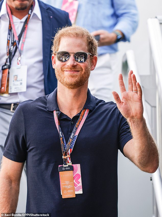 Waving: The royal was all smiles at the event, waving at photographers and mingling with several guests