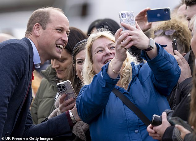 The Prince of Wales meets members of the public and takes selfies after a visit to The Street - a community hub in Scarborough - in November 2022