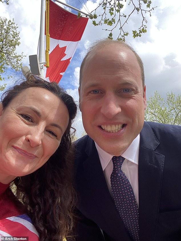 A royal fan gets close to Prince William during a walkabout on The Mall ahead of the Coronation