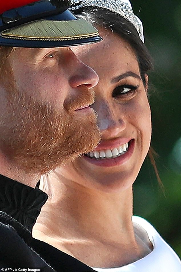 Meghan looking lovingly at her bristly new husband - and his beard - on their wedding day in 2018