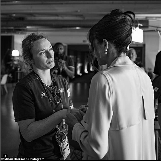 The woman in a photo with the Duchess of Sussex at the Invictus Games 2023 has revealed the story behind the black and white snap