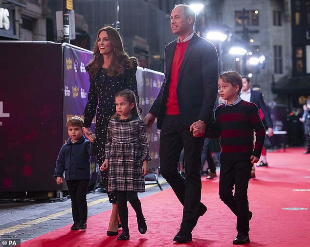 Kate and William with their children, Prince Louis, Princess Charlotte and Prince George , pictured last December attending a special pantomime performance at the Palladium Theatre