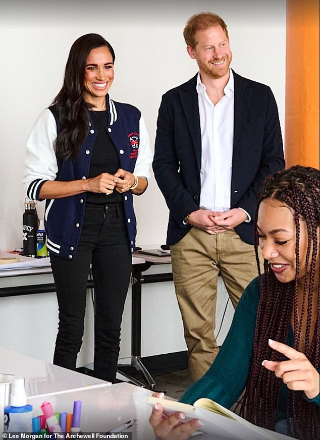 Prince Harry and Meghan Markle has paid a visit to a Brooklyn school, with the Duchess wearing a letterman jacket she was gifted during her last solo engagement as a working royal