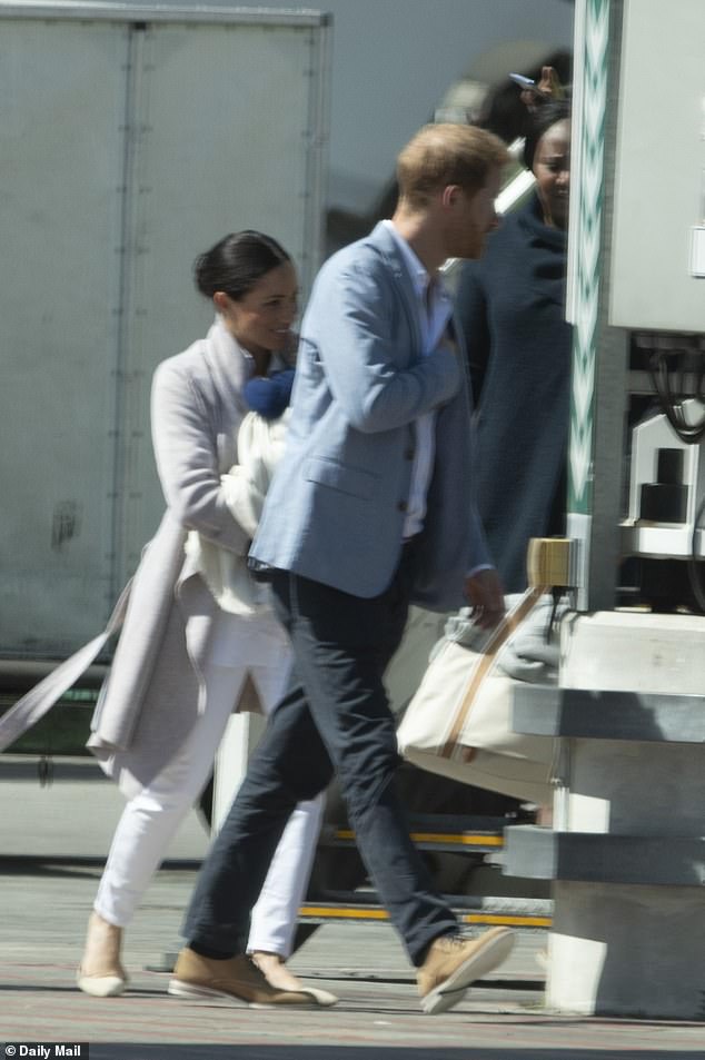 Harry and Meghan pictured with what is thought to be Archie's nanny in South Africa, named only as Lauren