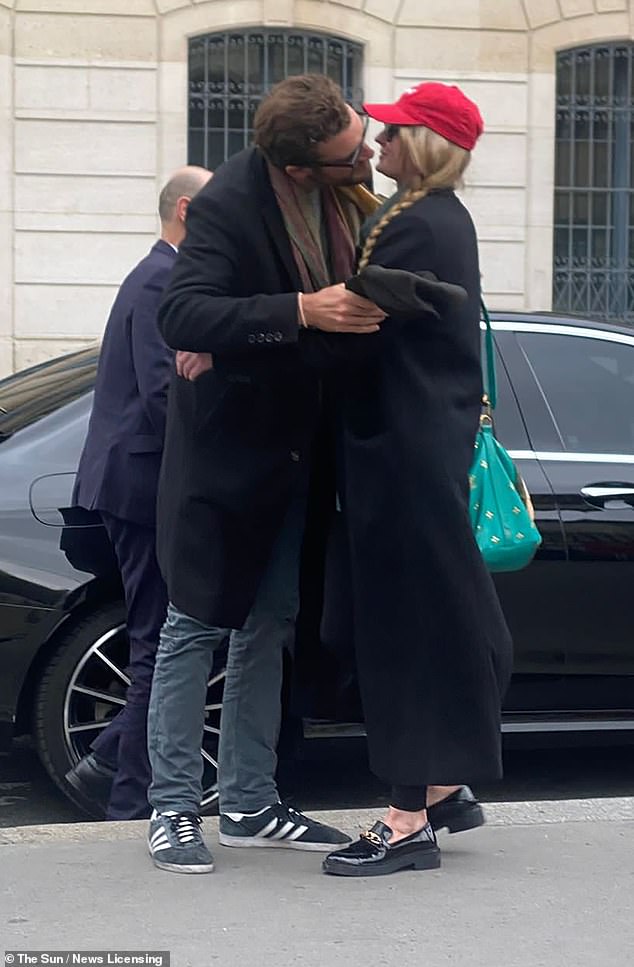 PDA: In the picture, Sophie is seen cutting a smart figure in an all-black ensemble and a red baseball cap as she shared a public kiss with Peregrine