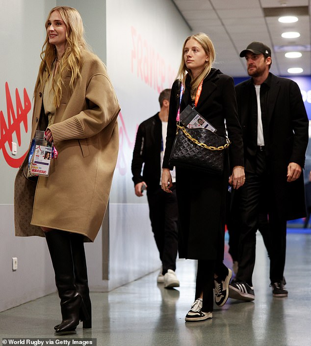 Outing: Just hours after the kiss, Sophie was seen smiling as she and Peregrine both arrived ahead of the Rugby World Cup Final match between New Zealand and South Africa