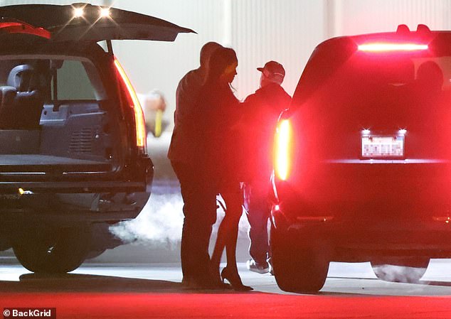 Meghan and Harry made their way back towards the car after landing