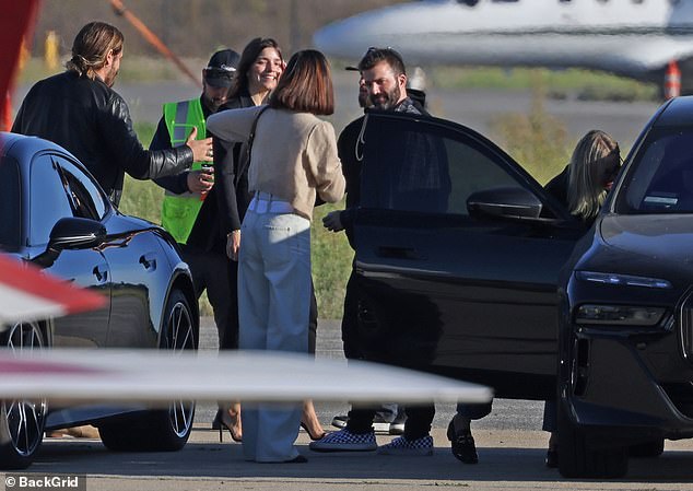 Zoe greeted Cameron out of the car as they both immediately went for a hug