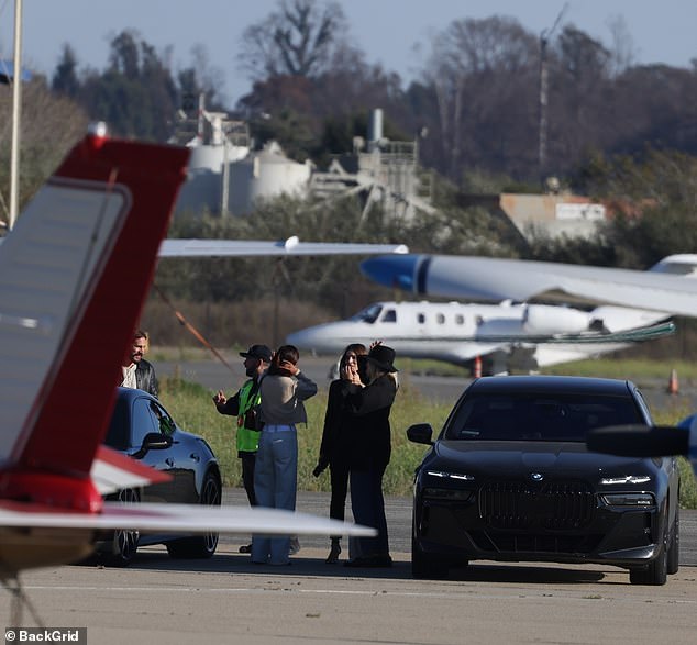 The A-listers appeared to be in deep conversation after meeting up at the airport