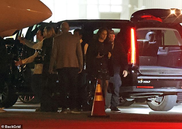 Another photo shows Meghan exiting a jet after the Katy Perry gig, with Madden just behind her