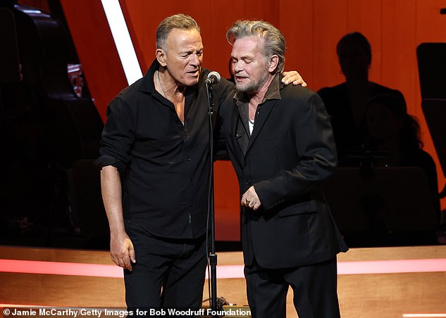 Bruce Sprinsteen and John Mellencamp perform onstage at Stand Up For Heroes last night