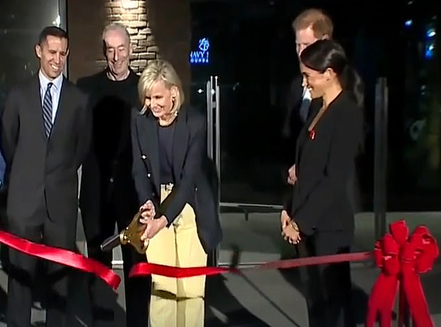 Meghan and Harry have helped cut the ribbon on a new military. CEO of the Navy SEAL Foundation  Robin King did the honours while others including former Navy SEAL Tony Duynstee (far left) watched on