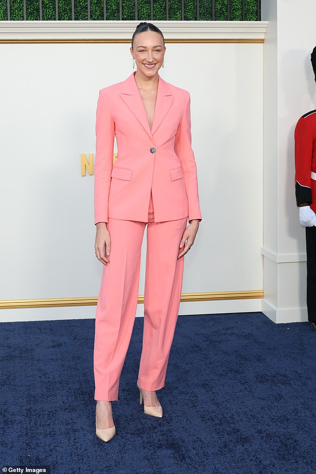 Pretty in pink: Ava Michelle, 21, was also present, and looked incredible in a pastel pink pantsuit