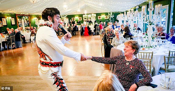 Undated The King's Foundation handout photo of an Elvis impersonator entertaining guests at Dumfries House in Scotland, the home of the King's Foundation, at a party staged in honour of King Charles III's 75th Birthday. Issue date: Monday November 13, 2023. PA Photo. See PA story ROYAL King. Photo credit should read: Iain Brown/The King's Foundation/PA WireNOTE TO EDITORS: This handout photo may only be used in for editorial reporting purposes for the contemporaneous illustration of events, things or the people in the image or facts mentioned in the caption. Reuse of the picture may require further permission from the copyright holder.