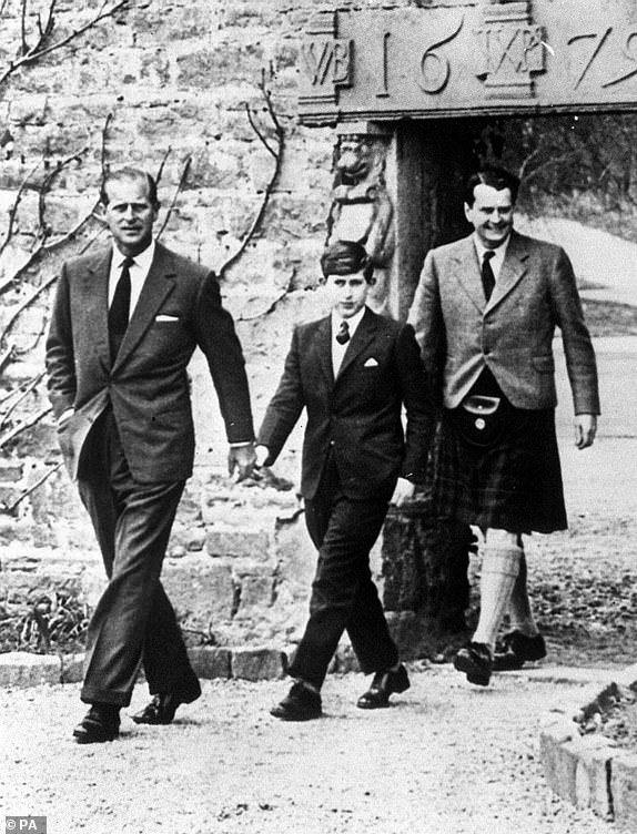 File photo dated 01/05/62 of Prince Charles with his father the Duke of Edinburgh (left) and Captain Iain Tennant, Chairman of the Gordonstoun Board of Governors, arriving at Gordonstoun for the Prince's first day at the public school. Photos from every year of the King's life have been compiled by the PA news agency  to celebrate King Charles III's 75th birthday. Issue date: Sunday November 12, 2023. PA Photo. Prince Charles Philip Arthur George was born on November 14 1948 at Buckingham Palace - the first child of the future Queen Elizabeth and the Duke of Edinburgh. As the Prince of Wales, he was the nation's longest serving heir to the throne, and he became King on September 8 last year on the death of his mother, the late Queen. The King, who was crowned in May, was the oldest British monarch in history at a coronation. PA Photo. See PA story ROYAL Birthday Gallery. Photo credit should read: PA Wire