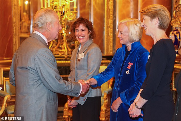 Charles greets Britain's newly appointed Health Secretary Victoria Atkins, Chief Nursing Officer for England Ruth May and CEOof NHS England Amanda Pritchard as he meets nurses and midwives to celebrate their work, at Buckingham Palace