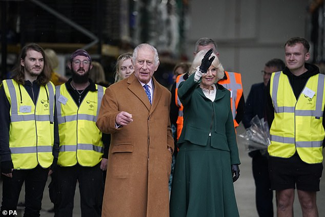 As workers at the food waste depot, wearing hi-vis jackets, looked on, the king and queen waved to those who'd made the journey to wish Charles a happy birthday