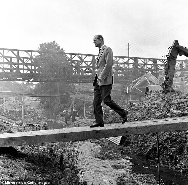 The Duke of Edinburgh worked to raise awareness for issues including poaching, deforestation and pollution. Pictured: Visiting the flood areas in July 1968