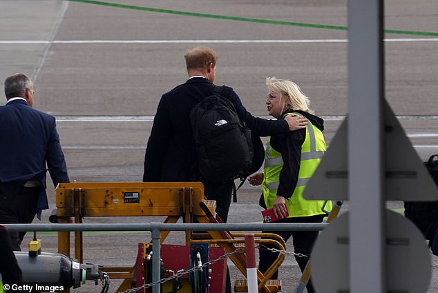 rince Harry, Duke of Sussex, boards a flight at Aberdeen Airport as he returned to London