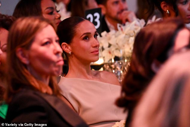 Meghan at her table with Universal's distribution chief Veronika Vandenberg (front, left)