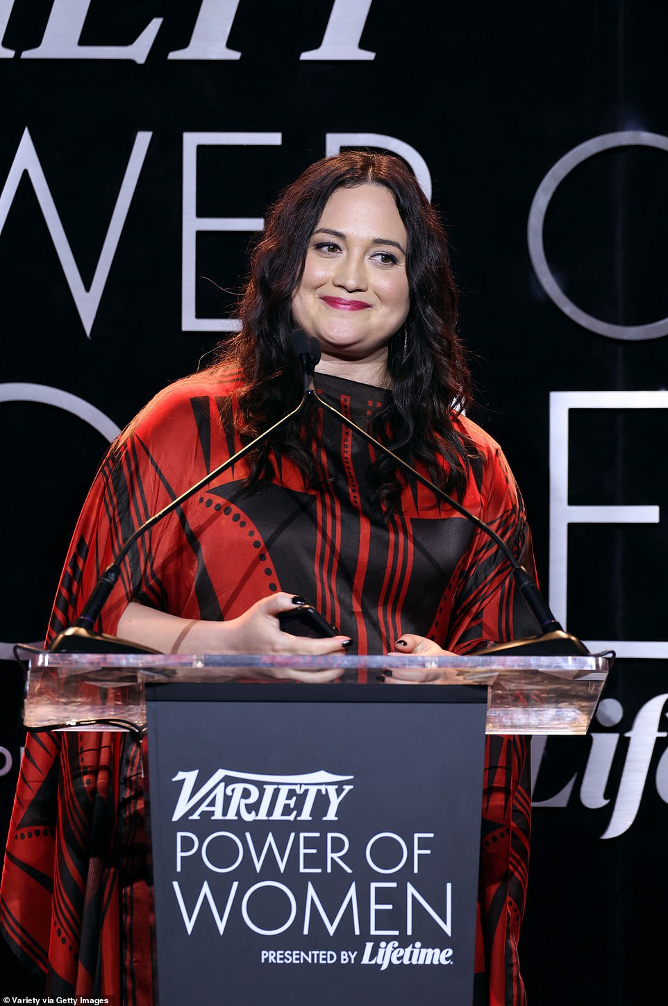 Black and red: Lily looked lovely in a black and red ensemble