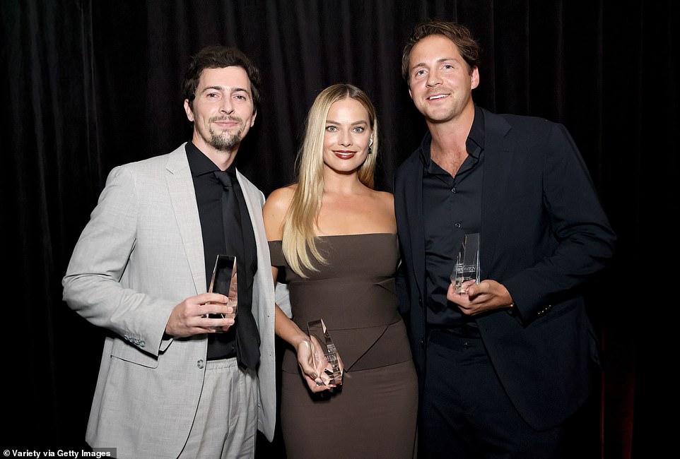 Producers of the year: Margo,  her husband, and Josey posed with their Producer of the Year Awards