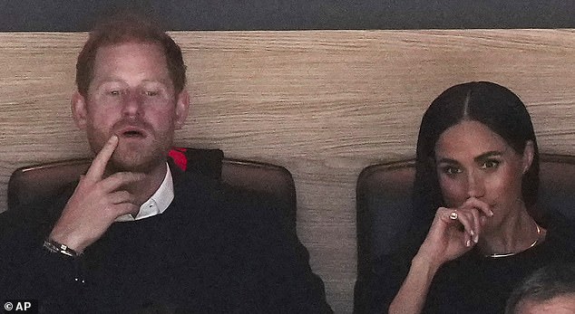 The Duke and Duchess of Sussex appeared focused as they watched the first period of the game