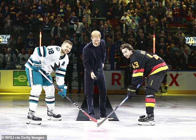 The ice hockey players smiled for the cameras as they prepared for Prince Harry to drop the puck