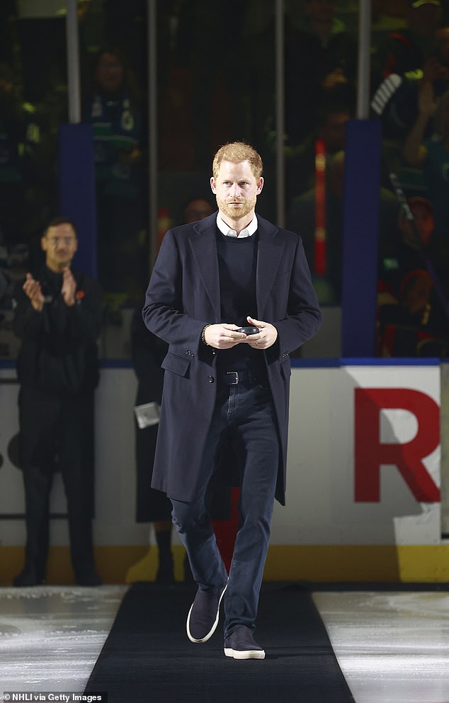 The Prince looked dapper in a shirt a jumper combination, which he matched with navy trainers