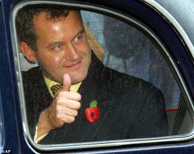 Paul Burrell gives a thumb-up as he leaves the Central Criminal Court on November 1, 2002, a free man after charges against him were sensationally dropped