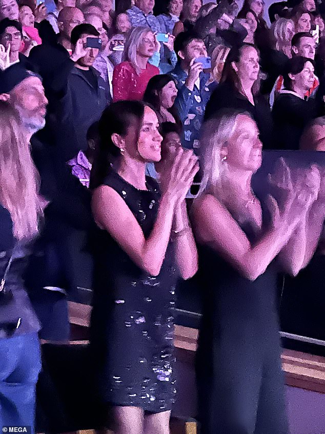 As the Sussexes' rift with other members of the royal family shows no sign of lifting, FEMAIL explores how their friends are doing their best not to take sides. Pictured: Meghan Markle at a Katy Perry concert in Santa Barbara last week