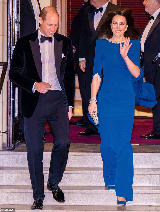 The Princess of Wales waves in her striking blue dress as she steps out alongside Prince William at the show in London