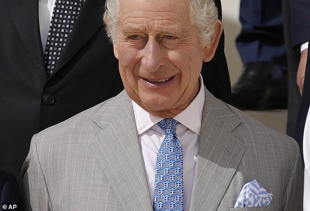 A storm has broken out over claims in Mr Scobie’s book that two Royals questioned what the skin colour would be of Archie, the first child of the Duke and Duchess of Sussex , while Meghan was pregnant. Pictured: King Charles at COP28 today