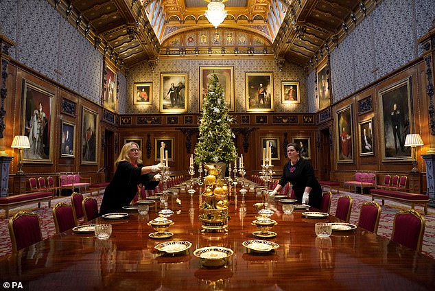 And the celebratory atmosphere can also be felt in the Waterloo Chamber, where a huge dining table is decorated with statement pieces, including trays of golden pears and fruits