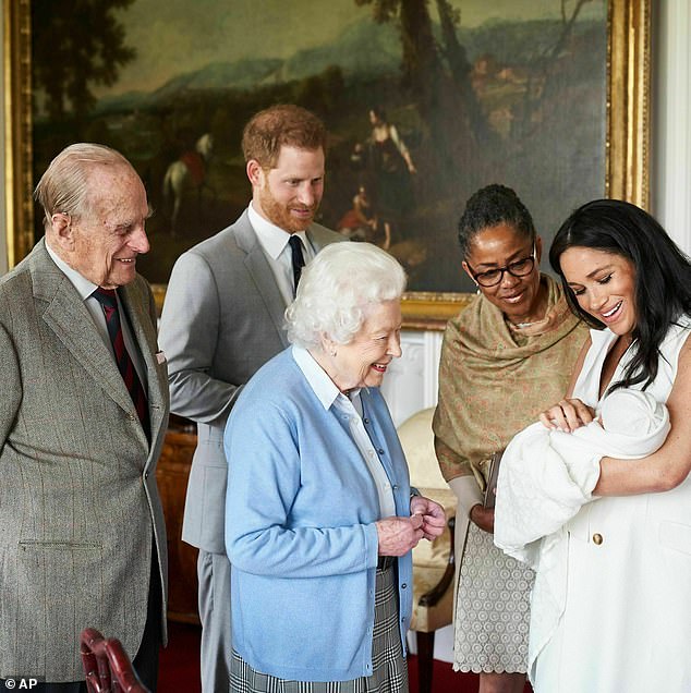 Prince Harry and Meghan, Duchess of Sussex, joined by her mother Doria Ragland, show their new son Archie to Queen Elizabeth II and Prince Philip at Windsor Castle in 2019