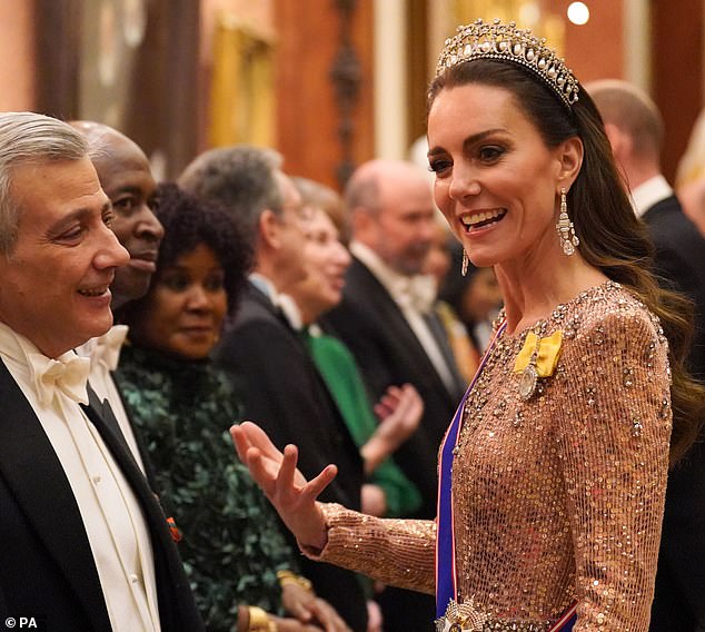 The Princess of Wales looked naturally charismatic as she entertained guests at Buckingham Palace in London last night