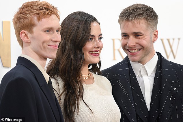 The final six episodes of The Crown are released on Netflix today. Pictured: Luther Ford, Meg Bellamy and Ed McVey - who play Harry, Kate and William - at the finale celebration this month