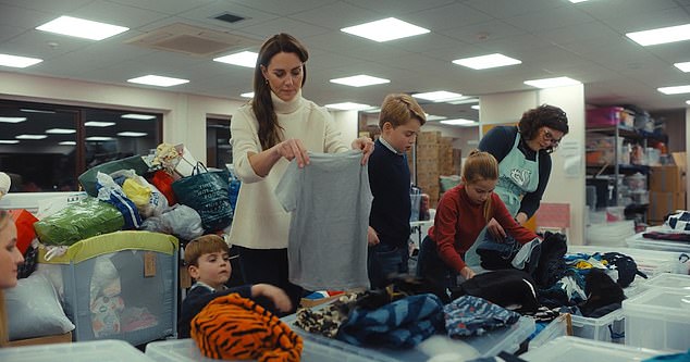 The Wales children helped their mother and volunteers pick out donations and make boxes to go to children in need for Christmas. From left: Louis, Kate, George and Charlotte